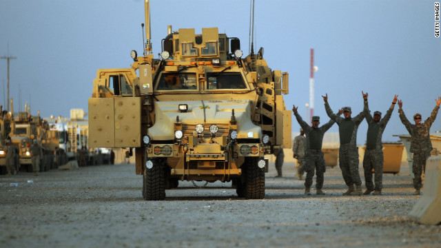 Soldiers rejoice in the convoy staging area before departing Camp Adder.