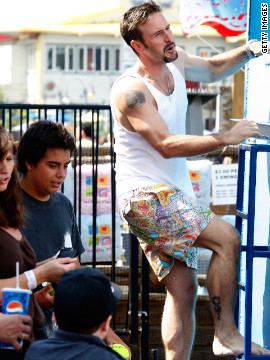 David Arquette sports a dragon tattoo on his calf. Rarely photographed in shorts, the actor's tattoo was visible as he climbed into a dunk tank at the Kinerase Skincare Celebration in 2007.