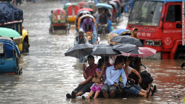 Bangladeshis attempt to stay dry above flood waters in the capital, Dhaka. Bangladesh was ranked by Maplecroft the country most vulnerable to climate change, and Dhaka the world's most vulnerable city, due to its exposure to threats such as flooding, storm surge, cyclones and landslides, its susceptible population and weak institutional capacity to address the problem.