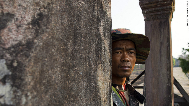 A Cambodian solider looks across at the Thai border from the ancient Preah Vihear temple in this file picture.