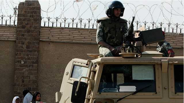 An Egyptian soldier stands guard outside courts at the Police Academy set up for the Mubarak trial in this file picture. 