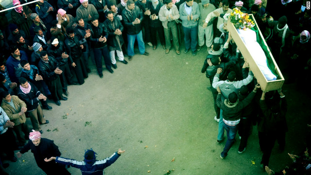 A funeral procession takes place in Dar Kabir in Homs for "Malik," who was killed by government forces. 