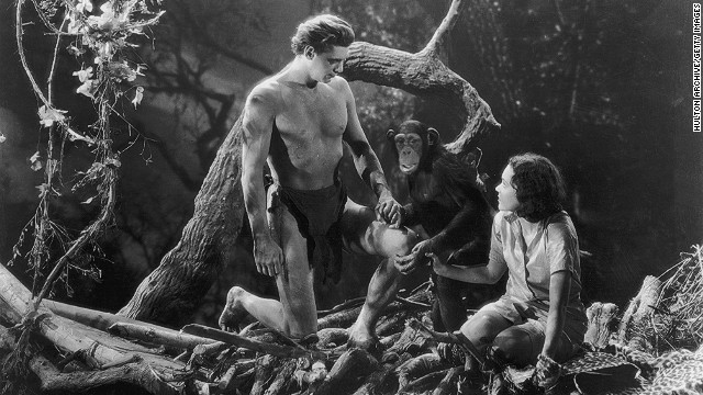 Johnny Weissmuller and Maureen O'Sullivan hold hands with Cheetah the chimpanzee in "Tarzan and His Mate."