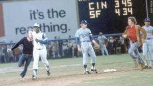 Hank Aaron -- and two young men -- rounded the bases after Aaron hit a record-breaking home run in 1974.