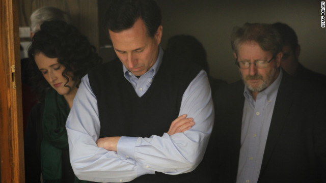  Rick Santorum bows his head in prayer during a campaign rally in Iowa this week.