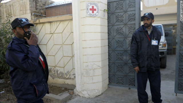 Security guards stand outside the office of the International Committee of the Red Cross in Quetta, Pakistan, on Thursday.