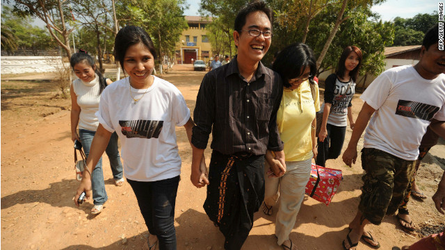 Myanmar blogger and prominent political activist Nay Phone Latt leaves with relatives following his release from detention on January 13, 2012.