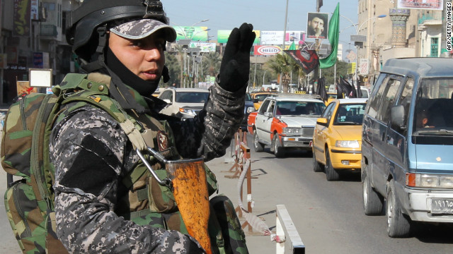 An Iraqi soldier mans a checkpoint in Baghdad on January 14, 2012.