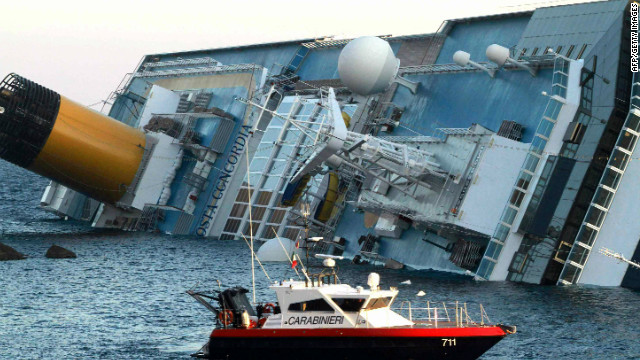 Italian police assist in the rescue after the cruise ship ran aground near the Italian island of Giglio.