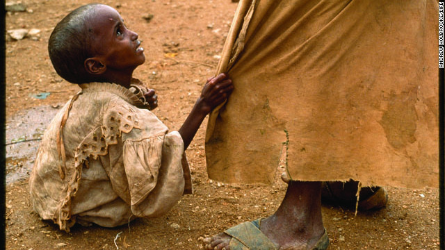 The photographs that appeared in LIFE magazine helped cement LIFE's reputation as the photography magazine of the 20th century. Photographer Andrew Holbrooke captured a starving girl pulling at her brother's robe at a Somali feeding station in 1992. Click through the gallery to see a selection of some of LIFE's most powerful images.