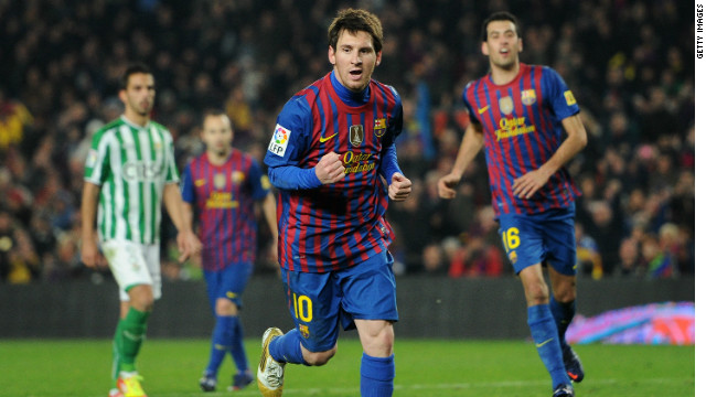 Lionel Messi celebrates scoring his second goal in Barcelona's 4-2 victory over Real Betis.