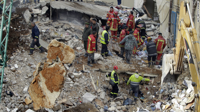 Rescuers search for survivors in the rubble of a collapsed building in Beirut's Ashrafiyeh neighbouhood on January 16, 2012. 
