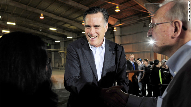 Republican presidential hopeful Mitt Romney greets voters Tuesday after giving a speech at a closed factory in Tampa, Florida.