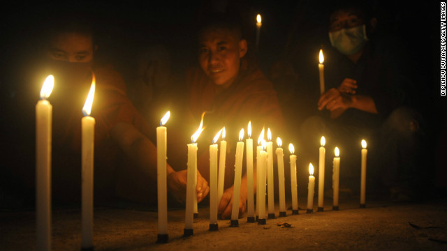 Buddhist people attend a candle vigil of the Tibetan Community in memory of self immolations in Tibet during the eighth day of the Kalachakra Festival in Bodhgaya, India, on January 8, 2012.