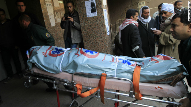Egyptian medics wheel the body of a victim into a morgue in Cairo on February 2, 2012.