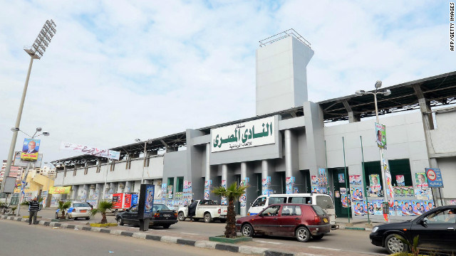 Egyptians drive past Port Said Stadium, home of Al-Masry, on February 2, 2012.