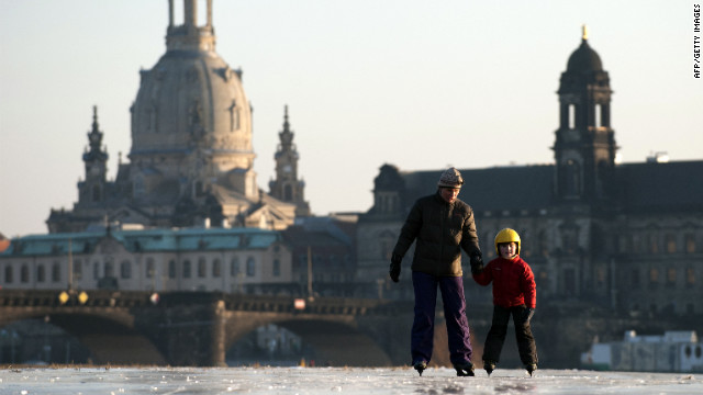<br/>A boy and his mother skate on the partly frozen Elbe River as the skyline of the eastern German city of Dresden is silhouetted in the background on Thursday, February 2. A cold snap kept Europe in its icy grip, pushing the death toll past 150 as countries from Italy to Ukraine struggled to cope with temperatures that reached record lows in some places.