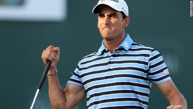 Rafael Cabrera-Bello celebrates on the 18th green after landing the Dubai Desert Classic.