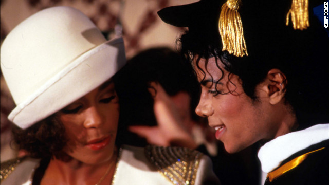 Whitney Houston stands with pop legend Michael Jackson in March 1988 in New York as Jackson receives an honorary Doctor of Humane Letters degree from the United Negro College Fund. Houston's sudden death at age 48 shocked fans and musicians all over the world.