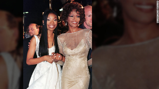 Singer-actress Brandy poses with Houston at the premiere of their made-for-television movie "Cinderella" in October 1997 in Hollywood.