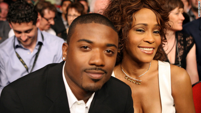 Houston and rapper Ray-J sit ringside for the Joe Calzaghe-Bernard Hopkins light heavyweight bout in April 2008 in Las Vegas.