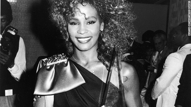 <br/> Whitney Houston poses with her American Music Award in 1986 backstage at the Shrine Auditorium in Los Angeles. 