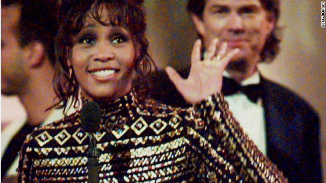 <br/>Houston waves to the crowd at the 36th Annual Grammy Awards in New York in March 1994, after she was honored for Record of the Year, "I Will Always Love You," and Album of the Year, the soundtrack from the film "The Bodyguard." 