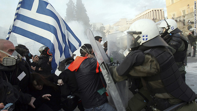 Protesters clash with police in the streets of Athens.
