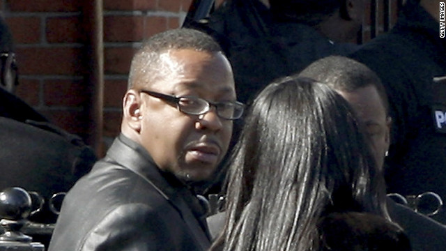 Bobby Brown, left, outside the funeral of his ex-wife, Whitney Houston. Brown later left abruptly.