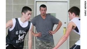 Chris Herren, center, launched a basketball clinic for kids the year after he got clean.