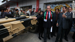 French defense minister Gerard Longuet, center, visits the War Museum on Sunday, in Misrata.