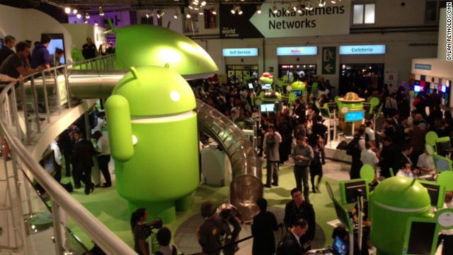 People wander through the Android display area. With no official Apple presence at the Mobile World Congress, Android phones dominate.