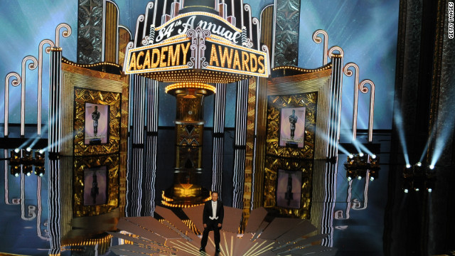 <br/>The 84th Academy Awards kicked off in typical Billy Crystal fashion. Before singing a tune about the nominees, the nine-time host put himself into the movies -- literally. He kissed George Clooney in a scene from "The Descendants," and Justin Bieber showed up in a spoof of "Midnight in Paris." Bieber said he was there to lower the demographic of the awards show -- specifically targeting the 18- to 24-year-olds.