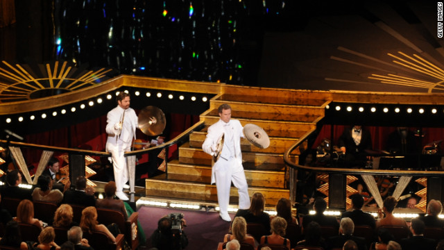 <br/>Wearing matching white tuxedos, Will Ferrell and Zach Galifianakis took the stage playing cymbals. Galifianakis mispronounced his own name while introducing himself, while Ferrell dropped his cymbal trying to open the envelope for best original song. "Man or Muppet" from "The Muppets" took the award.