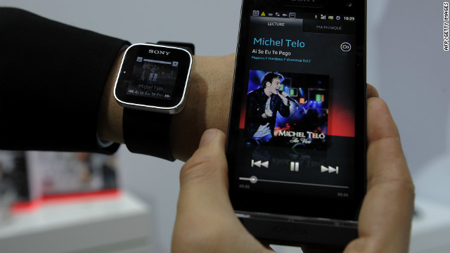 A man displays a Sony SmartWatch conected to a Sony mobile phone during a presentation at the Mobile World Congress on February 28