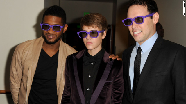 The pop idol attends the Los Angeles premiere of "Justin Bieber: Never Say Never," a 3-D documentary on his rise to stardom, in February 2011. He's accompanied by Usher and manager Scooter Bra!   un.