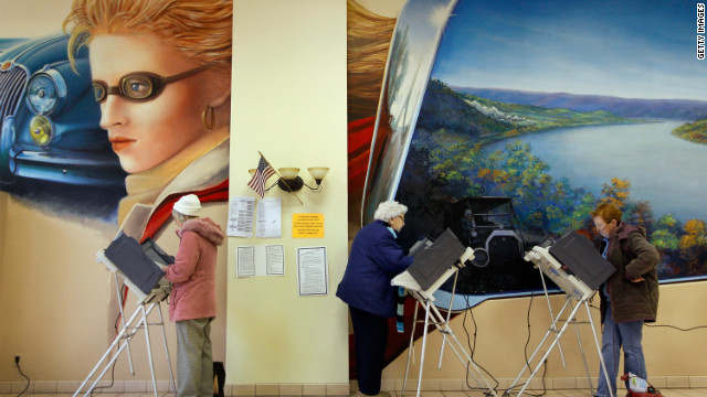  Voters fill out ballots at a polling station set up in Froehlich's Classic Corner in Steubenville, Ohio.