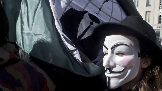 A protester wears an Anonymous mask to a rally in France.