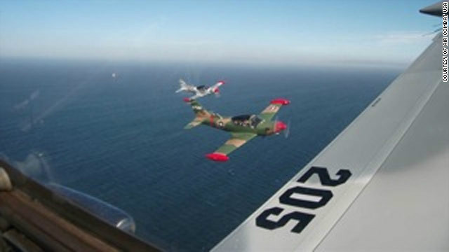 The view from the cockpit of a SIAI-Marchetti fighter plane ahead of an "executive dogfight."