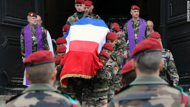 French 17th Parachute Engineer Regiment paratroopers carry the coffin of Abel Chennouf during his funeral at the Montauban cathedral on Wednesday. He was killed in the second attack in Montauban on March 15.