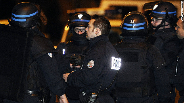 French killings suspect dead after siege, minister says