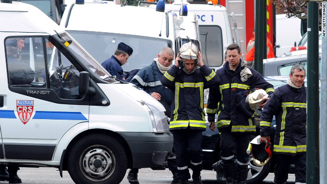 Police and rescue members are pictured after the siege ends on Thursday. Police burst into the apartment of Mohammed Merah, prompting a shootout that ended with Merah, gun in hand, jumping out a window to his death, authorities said Thursday.
