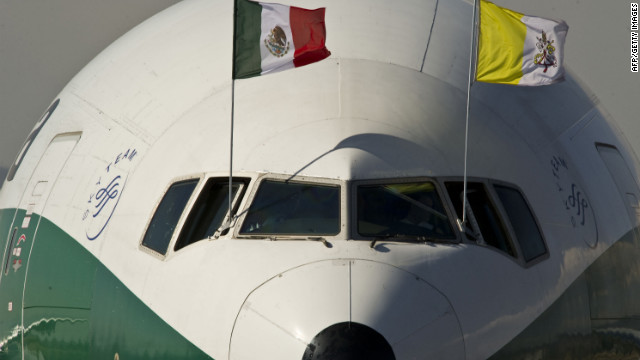 The airplane carrying Pope Benedict XVI, decorated with Mexican and Vatican flags, arrives on Saturday at Silao's international airport.
