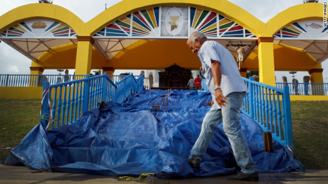 A worker prepares a stage for the arrival of the pope. He wil mark the 400th anniversary of Cuba's patroness, the Virgin of Charity of El Cobre.