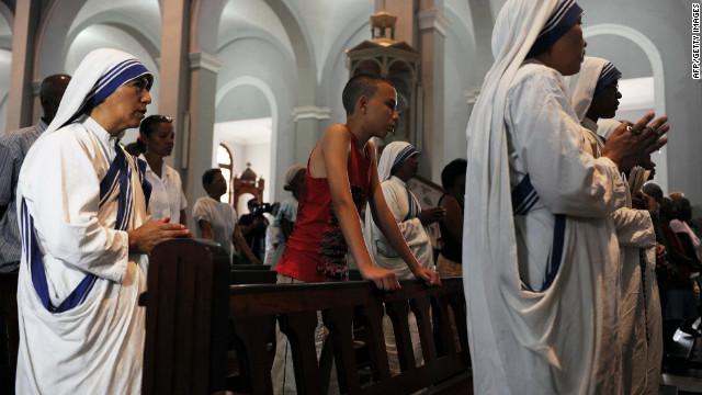 Nuns attend a mass at the Church of Charity in El Cobre, southeast of Havana. Unlike his visit to Mexico, Pope Benedict XVI is coming to a decidedly not-very-Catholic Cuba, hoping to inspire believers and bring new faithful to the fold.
