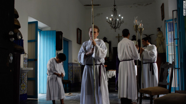 Alter boys prepare for the start of a morning service at Santo Angel Custodio church before the pope's arrival.
