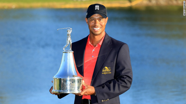 Tiger Woods displays the trophy on Sunday after winning the 2012 Arnold Palmer Invitational in Orlando, Florida.
