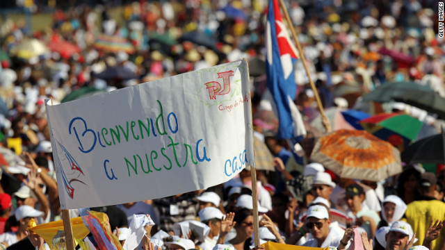 People await the arrival of Pope Benedict XVI in Revolution Square in Santiago de Cuba.