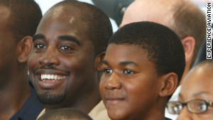 Trayvon Martin, at age 14, with pilot Barrington Irving at his youth aviation program.