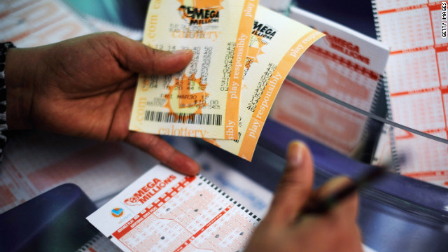  A woman fills out a Mega Millions ticket form at Liquorland in Covina, California.